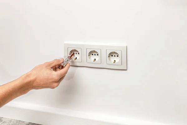 Human Hand Holding Screwdriver Plugged Outlet White Triple Socket Installed — Stock Photo, Image