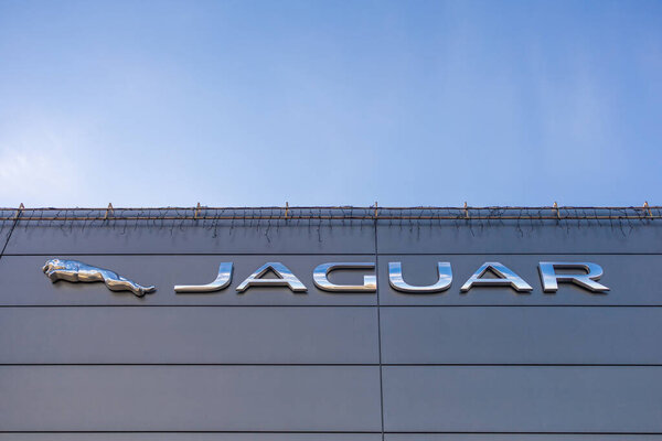 Jaguar's iconic leaping cat logo and branding on the exterior of an official dealership in Kyiv on January 31, 2024