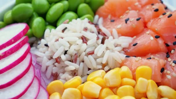 Poke Bowl Salmon Rice Edamame Beans Yellow Corn Radish Circling — Stock Video