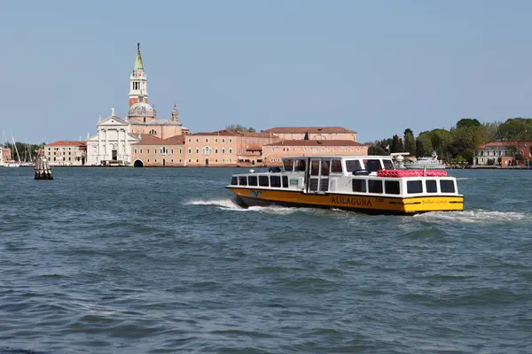 stock image Venice, Italy - May 01 2019: The San Giorgio Maggiore Benedictine Church is located along the Fondamenta promenade on Giudecca island, with various watercraft visible in the surrounding waters.