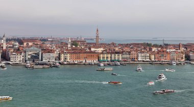 Venice, Italy - April 30 2019: A view of Venice with the city's iconic sights, art details, and architectural marvels visible from the bell tower of San Giorgio Maggiore church.  clipart