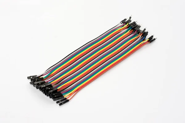 stock image Male to female jumper cable for Arduino. Set of colored connecting wires on white background. Wires for connecting modules and sensors for reliable connection and programming of microcontrollers