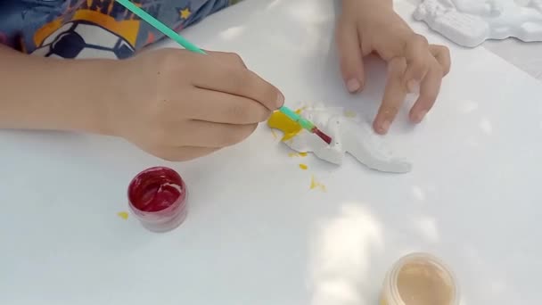 Preschool Child Drawing Plaster Blank Dinosaur Paints Hands Little Boy — Stock Video