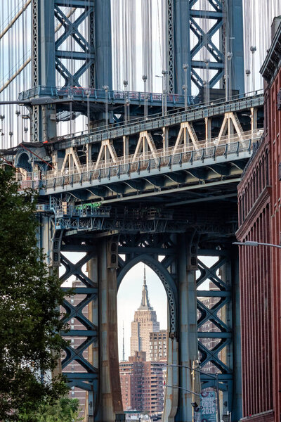 New York, USA - September 09, 2019: View of Manhattan Bridge and Empire State Building view from Washington Street in Brooklyn, New York