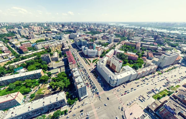 stock image Aerial city view with crossroads and roads, houses, buildings, parks and parking lots, bridges. Urban landscape. Copter shot. Panoramic image.