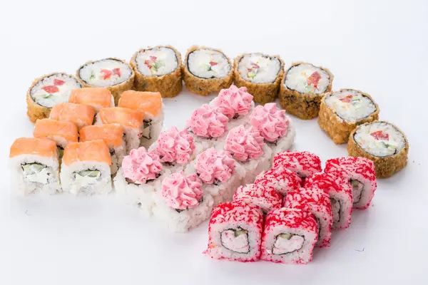 寿司セットと白い背景で構成 日本食レストラン 寿司巻軍艦ロール プレートまたは大皿セット ストックフォト