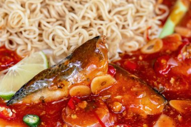 Boiled ramen with canned fish in tomato sauce