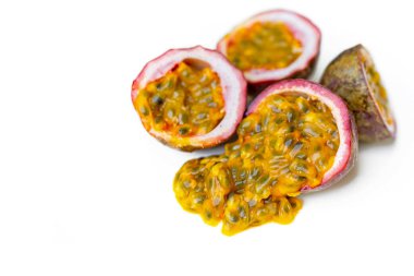 passion fruit with flesh and seeds on white background