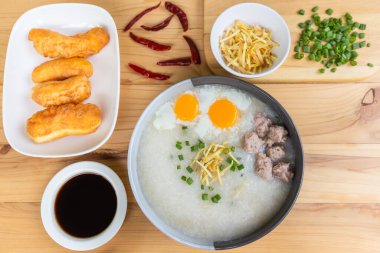 rice porridge or congee with minced pork and soft-boiled eggs