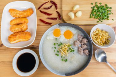 rice porridge or congee with minced pork and soft-boiled eggs