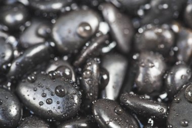 water droplets on black stone