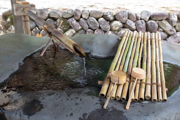 stock image A well for washing hands before entering the shrine in Japan