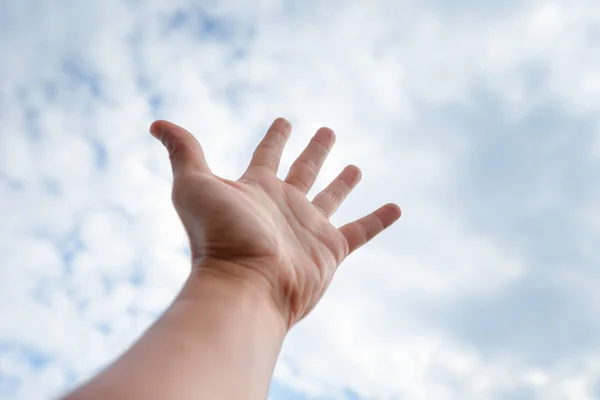 stock image raise your hand to the sky