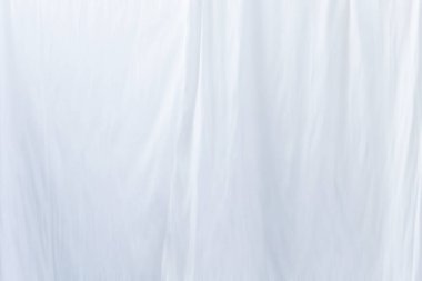 light gray background. texture of white silk fabric.