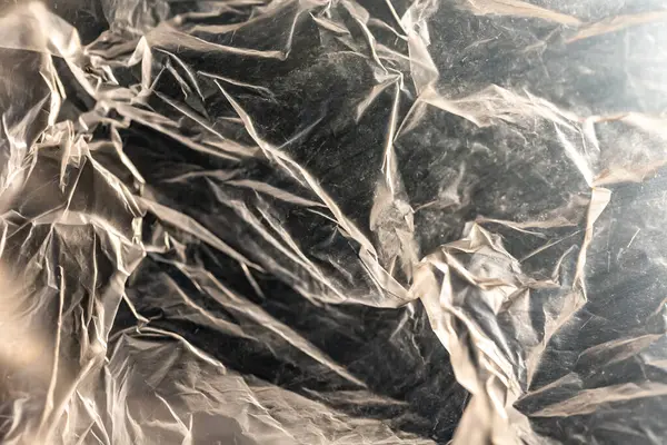 Buruşmuş alüminyum folyo dokusu. Tasarım için soyut arkaplan ve doku.