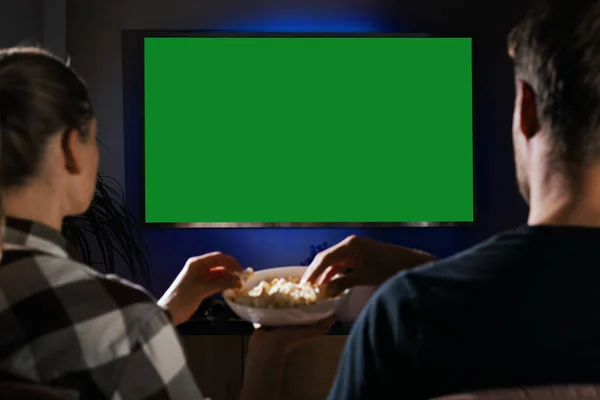 Couple Together Relaxing Couch Home Eating Popcorn Watching Blank Green — Stock Photo, Image