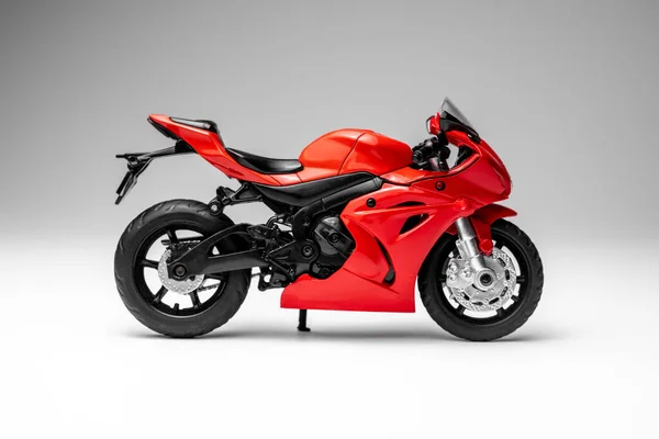 stock image red sportbike motorcycle model on white background