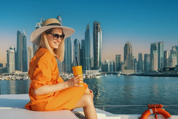 Smiling Woman Orange Dress Drink Luxury Yacht Dubai Sunset City — 스톡 사진