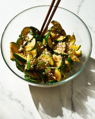 Korean zucchini salad. Stir fried zucchini with garlic and chilli. Sauce are made from fish sauce with sugar and chilli flakes. High quality photo