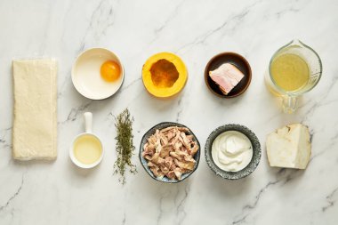 Chicken pie ingredients pumpkin with chicken and thyme plus puff pastry. Also wine and egg cheese and celery chicken stock . High quality photo