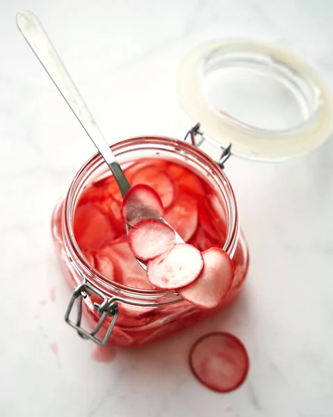 Jar Pickled Thinly Sliced Pink Radishes Spoon Sticking Out Jar Imagen De Stock