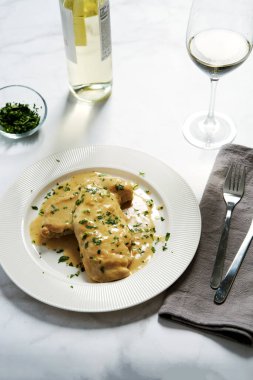 Chicken breasts in mustard sauce on white plate. High quality photo