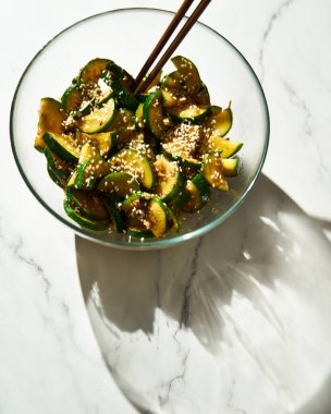 Korean zucchini salad. Stir fried zucchini with garlic and chilli. Sauce are made from fish sauce with sugar and chilli flakes. High quality photo