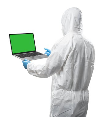 Worker wears medical protective suit or white coverall suit with blank screen laptop isolated on white background