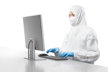 Worker wears medical protective suit or white coverall suit work with computer isolated on white background