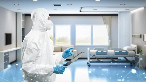 Doctor wears medical protective suit or white coverall suit with digital tablet work in hospital room