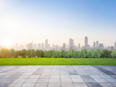 3d rendering roof top balcony or patio with green garden on cityscape background