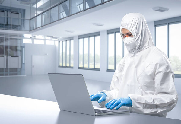 Рабочий или инженер носит защитный костюм или белый комбинезон на заводе по производству полупроводников