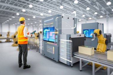 Teknisyen veya mühendis fabrikada robotik silahlarla çalışıyor.