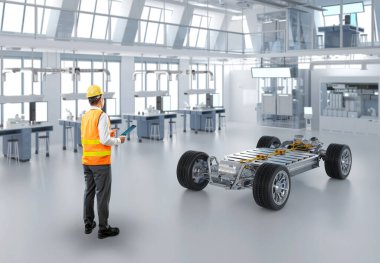 Fabrikada her arabayla Asyalı mühendis veya teknisyen çalışıyor.