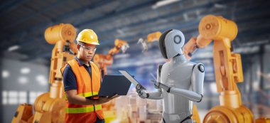 Otomasyon endüstrisi konsepti fabrikadaki robot montaj hattını kontrol ediyor.