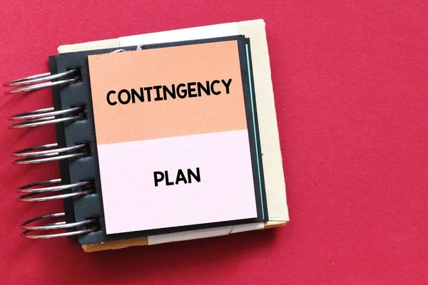 CONTINGENCY PLAN - words on colorful pages of the notebook. Info concept