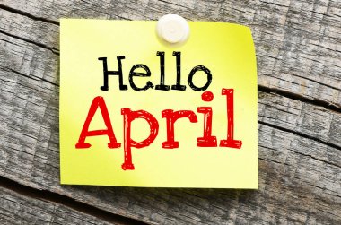 HELLO APRIL words on a small piece of paper.