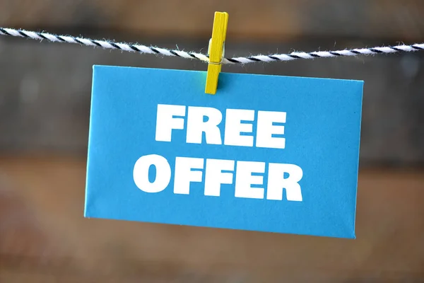 FREE OFFER words on a blue piece of paper.
