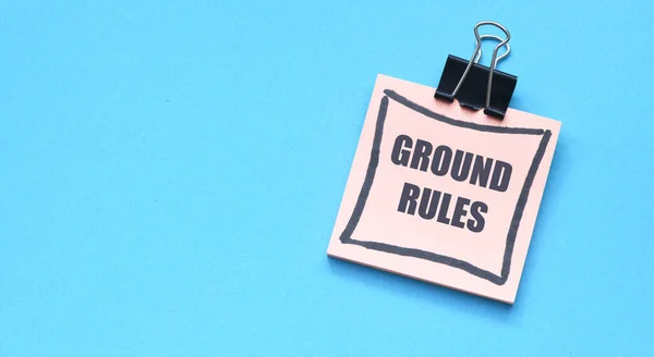 stock image GROUND RULES words on a small piece of paper.