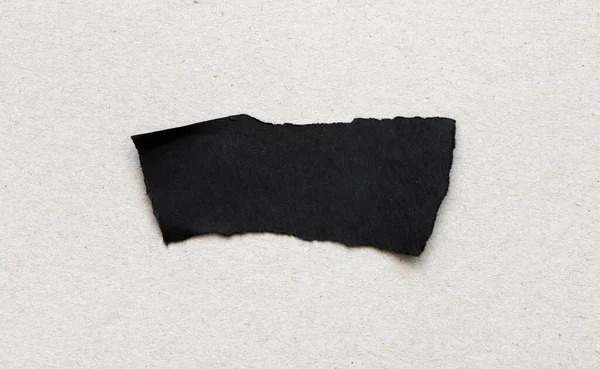 Czarny Kawałek Kartki Papieru Szarym Tle — Zdjęcie stockowe