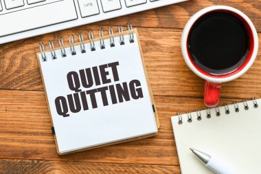 Quiet Quitting words in an office notebook. clipart