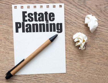 Bir kağıt parçasında emlak planlama sözcükleri.