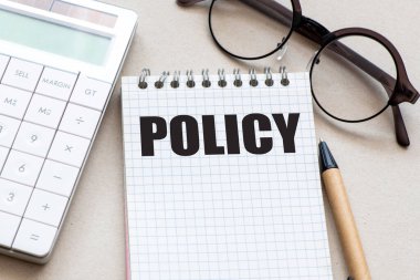 Ofis defterindeki POLICY sözcüğü.