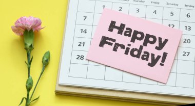 Bir sayfa kağıt ve takvimde mutlu cuma günleri..