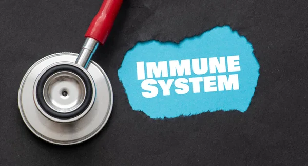 Parola Immune System Pezzo Carta Accanto Uno Stetoscopio — Foto Stock