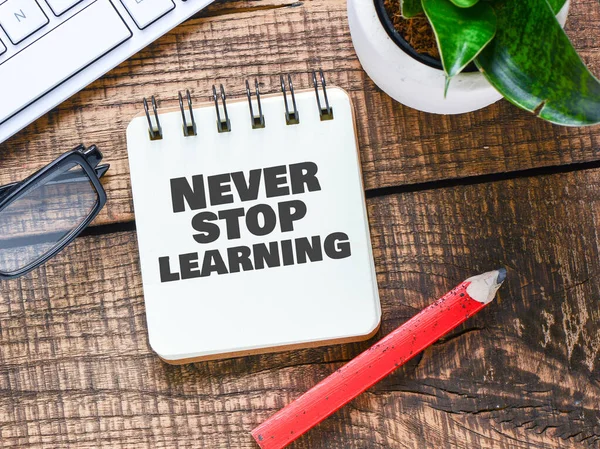 Never stop learning words in your notebook. Lifelong learning concept.