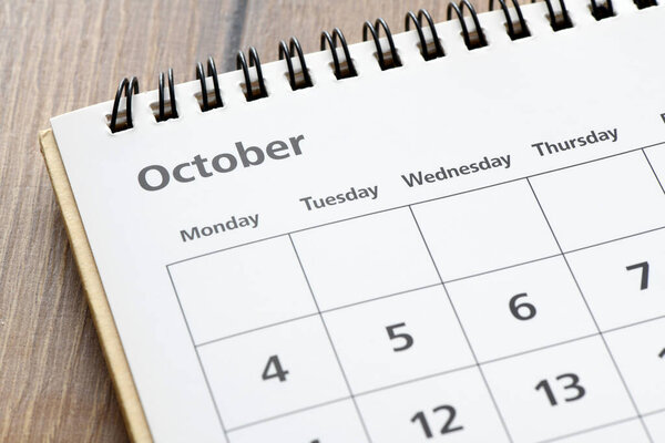 October Monthly desk calendar on wooden table