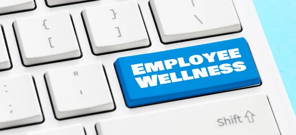 Employee Wellness words on a blue key of a computer keyboard.