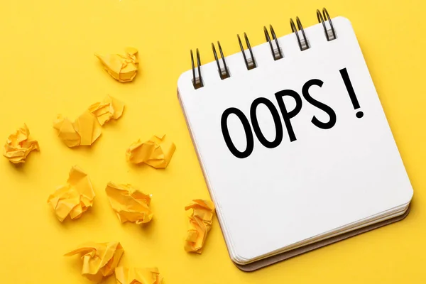 Words Oops Black Marker Notebook Yellow Background Apologies Minor Accident — Stock Photo, Image