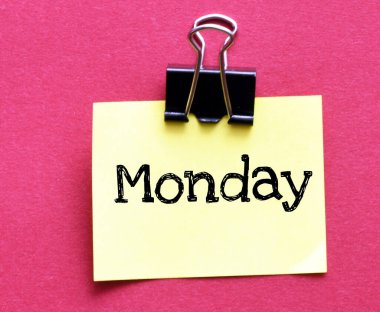MONDAY word on a small piece of paper.